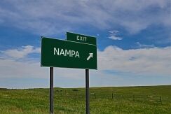 Highway exit sign for Nampa, Idaho, representing travel routes and dangerous roads highlighted in Nampa car accident safety guide.